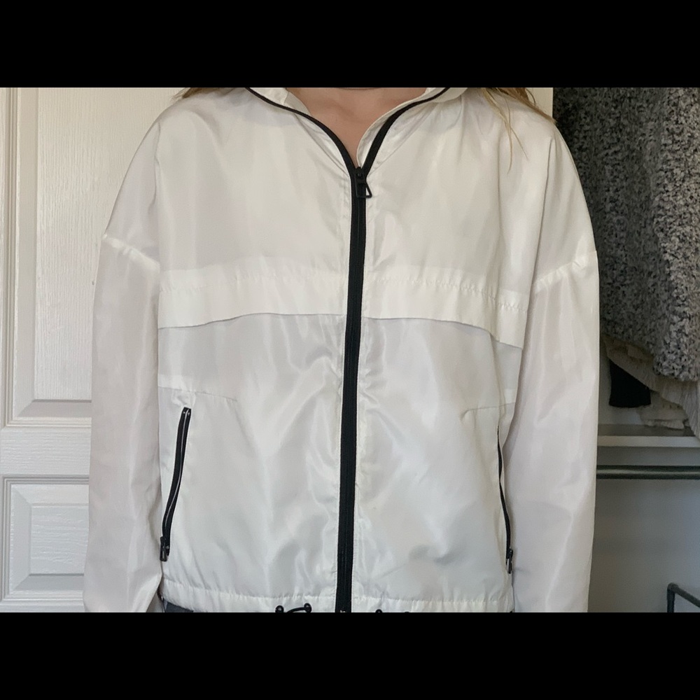 white windbreaker